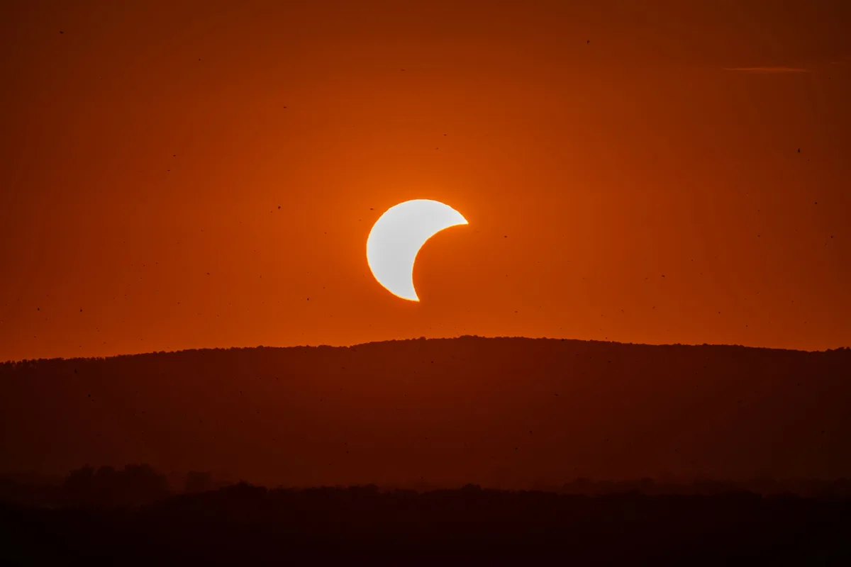 Beautiful solar eclipse at sunset over Garešnica in Bjelovarsko-bilogorska, Croatia.