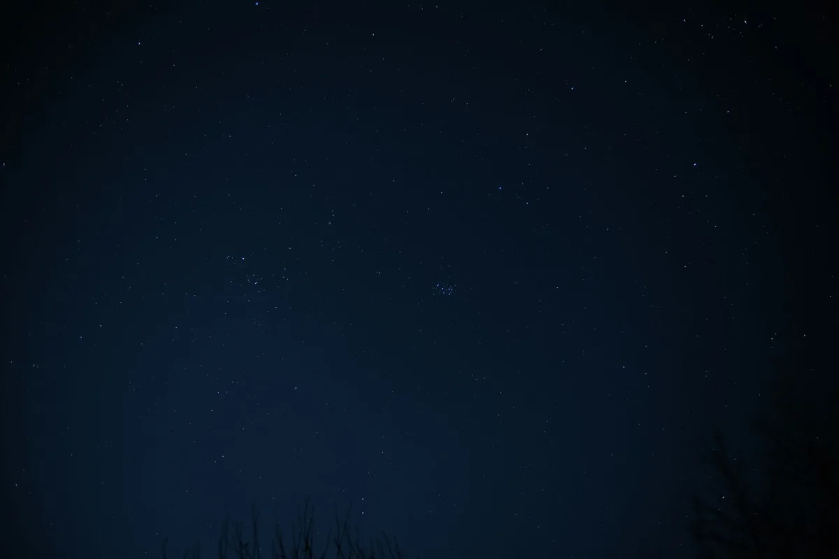 A serene view of a night sky filled with stars and constellations.