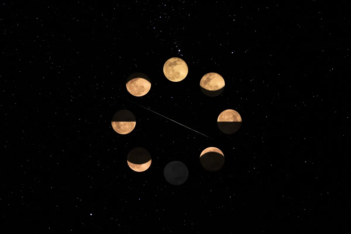 Illustration of the moon phases against a star-filled night sky, highlighting lunar cycle.